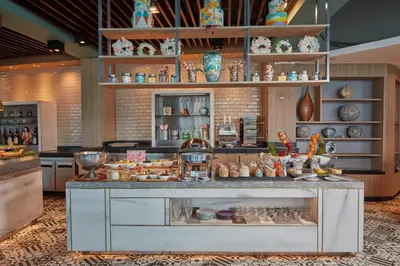 a kitchen with a counter filled with lots of items at Crowne Plaza Manila Galleria by IHG in Manila