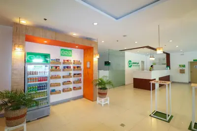 a grocery store with a cash register and a counter at Go Hotels Manila Airport Road in Manila
