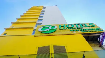 a yellow building with a go hotels sign on it at Go Hotels Manila Airport Road in Manila