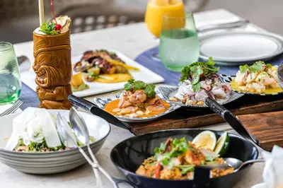 a table with plates of food on a table at Shangri-La Residences The Fort, Manila in Manila