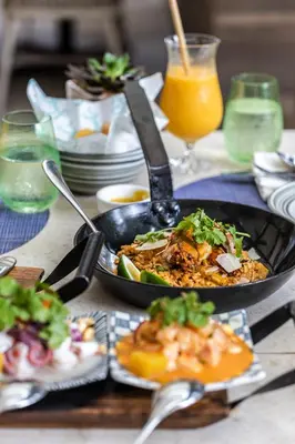a table with a plate of food on a table at Shangri-La Residences The Fort, Manila in Manila