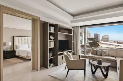 a living room with a bed and a couch at Shangri-La Residences The Fort, Manila in Manila