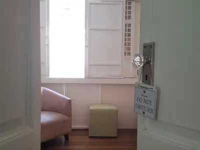 a door with a do not disturb sign next to a window at Charming La Casita Mercedes, 5Br and 5TB for Family and Friends Staycation- Read Listing Info in Manila