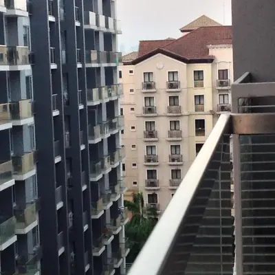 a view from the balcony of an apartment building at Palm Tree Villas by Ann in Manila