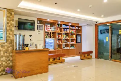 a drugstore with a counter and a pharmacistasteryasteryasteryasteryasteryastery at MySpace Hotel @BGC in Manila
