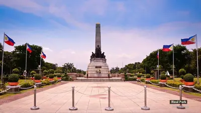 a monument with flags in front of it at MySpace Hotel @BGC in Manila