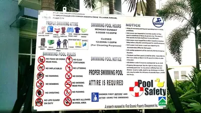 a sign in front of a building that has a menu at 3N Palm Tree Villas in Manila