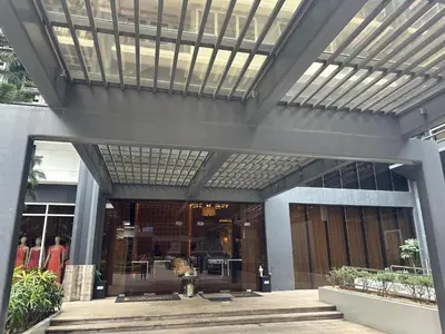 a lobby of a building with a glass ceiling at Luxury suite next to Shangrila and Westin Hotels in Manila