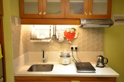 a kitchen counter top with a sink and a counter top at A Homey Place At Adriatico in Manila