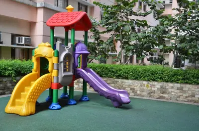 a group of childrens play equipment on a playground at A Homey Place At Adriatico in Manila