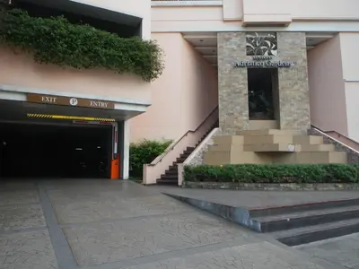 an entrance to a building with a parking garage at A Homey Place At Adriatico in Manila