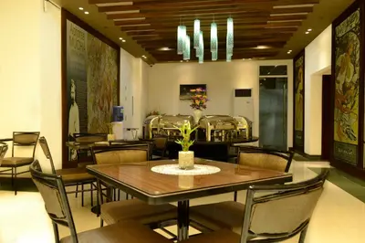 a dining room with a table and chairs at Eurotel Vivaldi Araneta in Manila