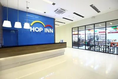 a store with a hippin logo on the wall at Hop Inn Hotel Ermita Manila in Manila