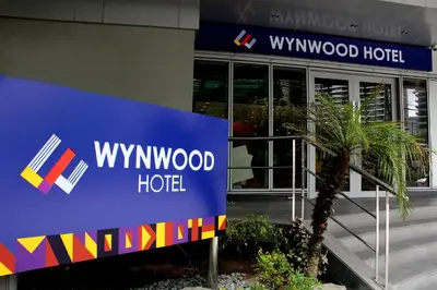a wynwood hotel sign in front of a building at Wynwood Hotel in Manila