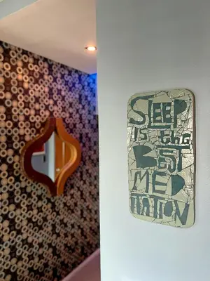 a mirror hanging on a wall next to a wall at The Beacon Residences Condominium in Manila