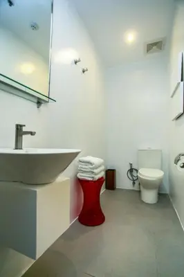 a bathroom with a sink and a toilet at Hotel Durban in Manila