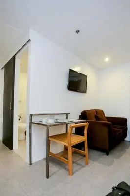 a living room with a table and a couch at Hotel Durban in Manila
