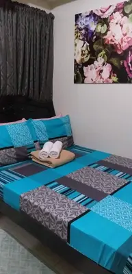 two beds in a room with towels on them at 1Bedroom with Balcony in Manila