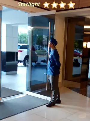 a man is standing outside of a building at 1Bedroom with Balcony in Manila