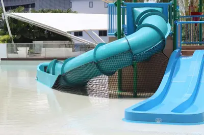 a blue slide at a water park at Azure Tropical Paradise in Manila