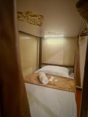 a small bed in a small room with at Park Avenue Boutique Hotel Manila in Manila
