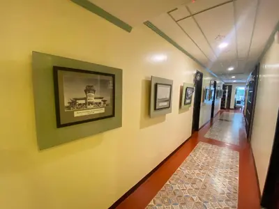 a hallway of a building with a picture on the wall at Park Avenue Boutique Hotel Manila in Manila