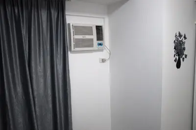 a room with a radiator and a air conditioner at Jazz Makati Luxury Apartment in Manila
