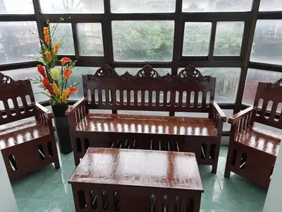 a room with two benches and a table in front of a window at N&J Lopez Lodging House in Manila