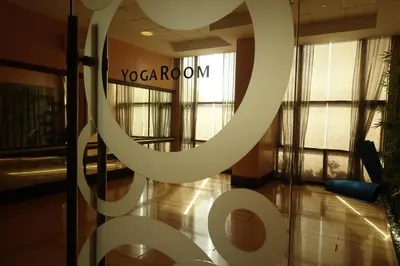 a lobby with a sign that reads yo calcium at Modern Asian Condo at Forbeswood Parklane The Fort BGC in Manila