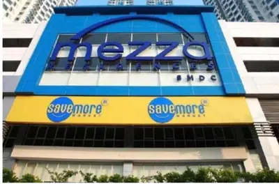 a blue and yellow sign on the side of a building at Sm Mezza Residences in Manila