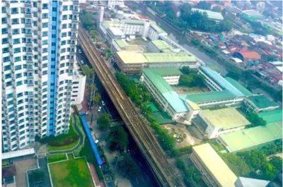 an overhead view of a city with buildings and train tracks at Sm Mezza Residences in Manila