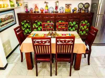 a dining room with a table and four chairs at Entire House with 4 rooms near SM Molino and Vermosa Ayala in Imus