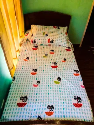 a bed with a hello kitty comforter on it at Entire House with 4 rooms near SM Molino and Vermosa Ayala in Imus