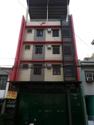 a tall building with a lot of windows at Budget Studio Unit in Makati in Manila