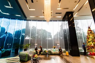 a christmas tree in the lobby of a hotel at 1BR Milano Residences by Versace in Manila