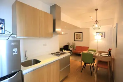 a kitchen with a sink and a counter top at Maui Condotel Azure Residence in Manila