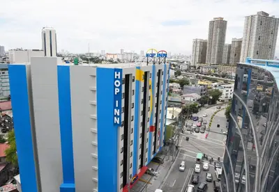 a view of the city from the roof of a building at Hop Inn Hotel Makati Avenue Manila in Manila