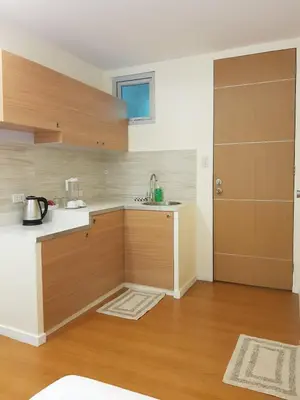 a kitchen with a sink and a counter top at The Leaf House in Manila