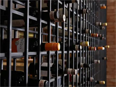 a bunch of wine bottles in a wine rack at Manila Lotus Hotel in Manila
