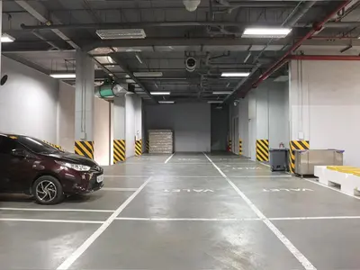 a parking garage with a car parked in it at Go Hotels Ermita, Manila in Manila