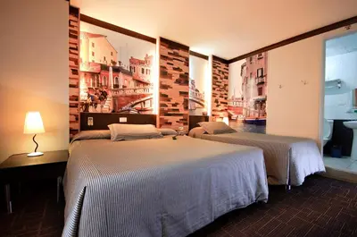 a hotel room with two beds and a window at Eurotel Makati in Manila