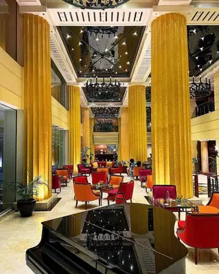 a restaurant with tables and chairs in a building at The Heritage Hotel Manila in Manila