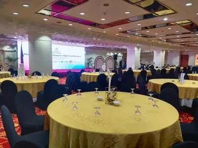 a conference room with tables and chairs with wine glasses at The Heritage Hotel Manila in Manila