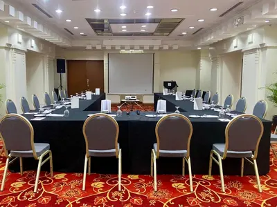 a large meeting room with a large table and chairs at The Heritage Hotel Manila in Manila