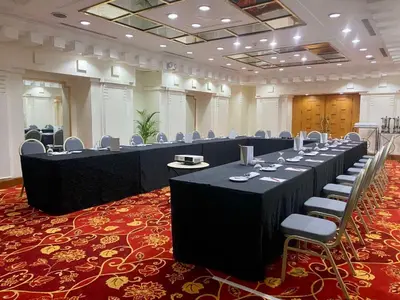 a large room with tables and chairs in it at The Heritage Hotel Manila in Manila
