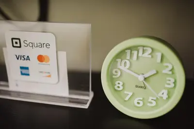 a green clock sitting next to a box at Yong's Place at Vista Residences Taft in Manila