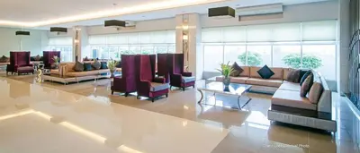 a lobby with couches and chairs in a building at Luxury Condo-Princeton Residence-New Manila Quezon City-Fast Wi-fi150mbps in Manila