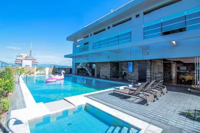 a swimming pool with a pink flamingo in a building at Greenhills Elan Hotel Modern - Newly Renovated in Manila