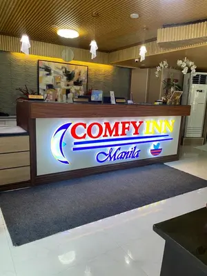 a company in miami sign on a counter in a store at Comfy Inn Manila-Kalaw in Manila
