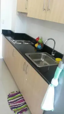 a kitchen counter top with a sink and a sink at Light Residences 1BR Apartment Balcony in Manila